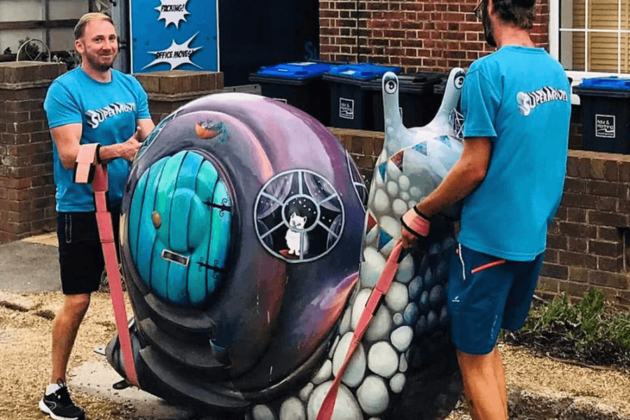 SuperMover team moving a Huge Snail structure from a property